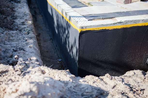 Professional Emergency Waterproofing technician working in McBain, MI